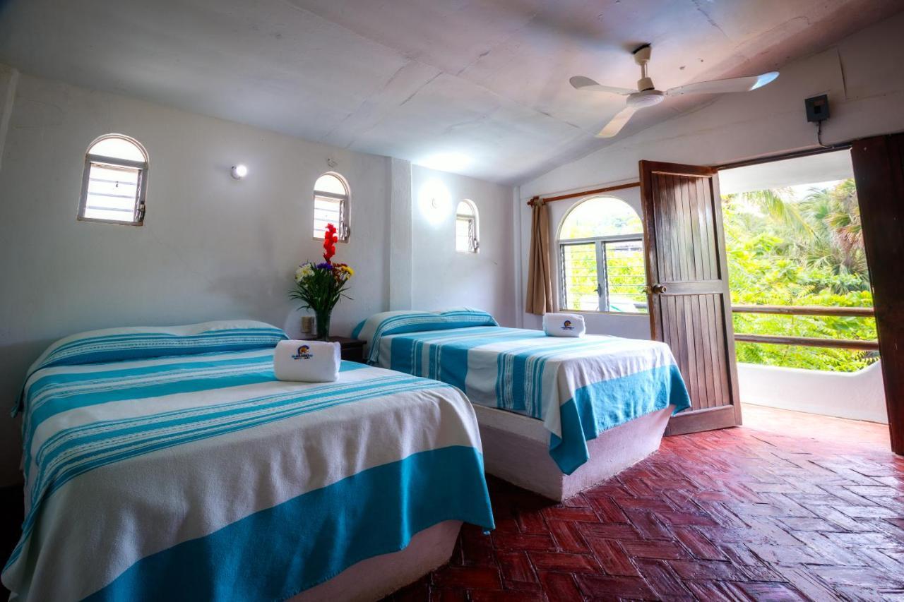 Hotel Bungalows Acuario ปูแอร์โตเอสกอนดิโด ภายนอก รูปภาพ